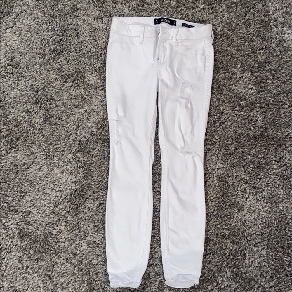 white skinny jeans with a couple of small rips